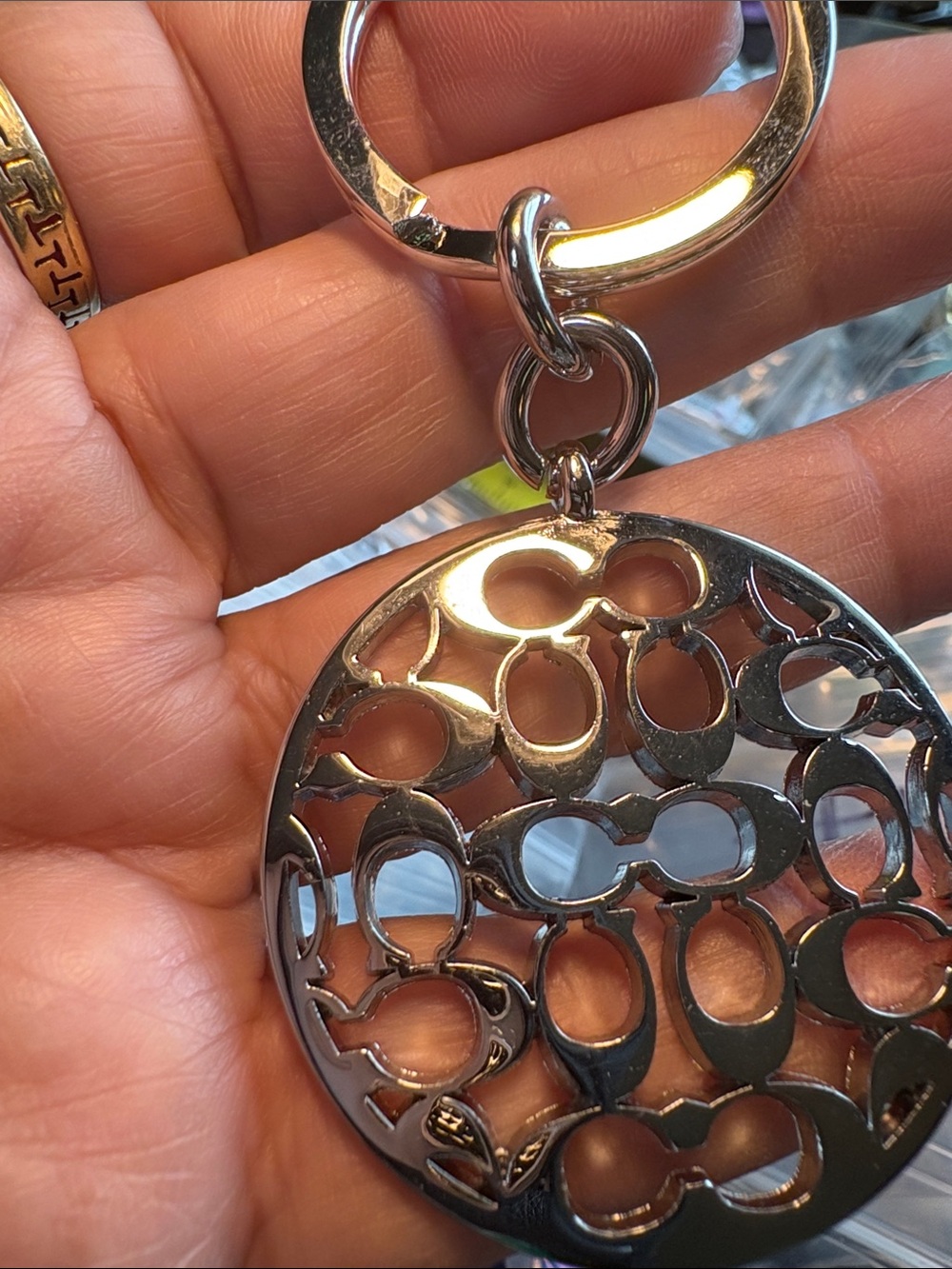 Coach Silver-Tone Circular Signature Cutout Keyring - Picture 2 of 4